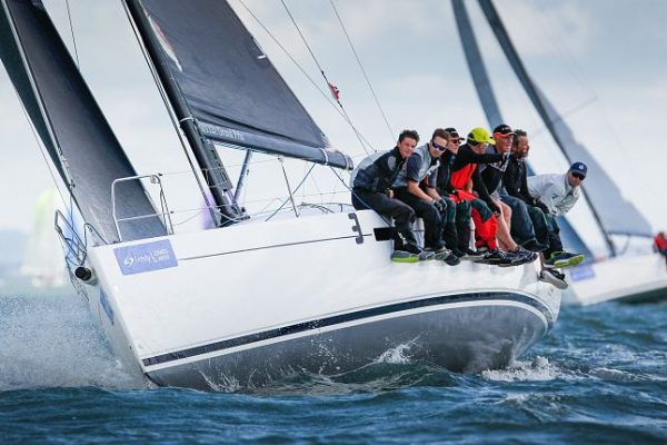 Sailors in wet weather gear taking part in Cowes