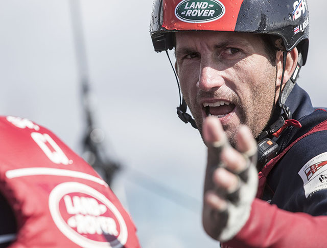 Ben Ainslie in red and black out on the water