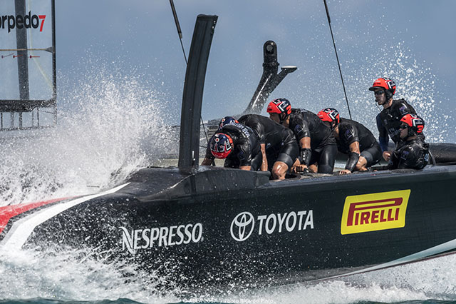 Sailors cycling on an America's Cup boat
