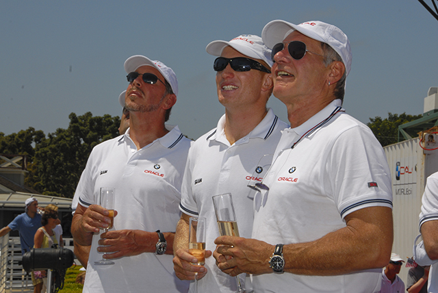Harrison Ford, Jimmy Spithill and Larry Ellison dressed in white t-shirts and caps