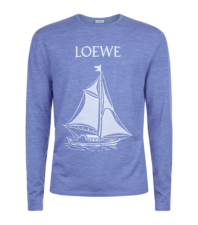 A blue wool jumper with a white sail boat 