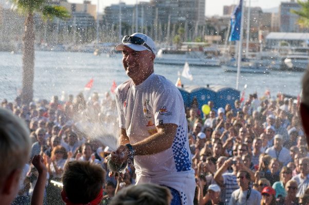 Volvo Ocean Race veteran Bouwe Bekking spays Champagne into the crowd