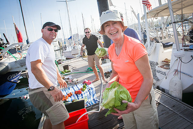 Sailors sort out their provisions on the dock