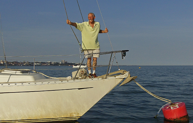 British Golden Globe Race hopeful Robin Davie on the bow of his yacht