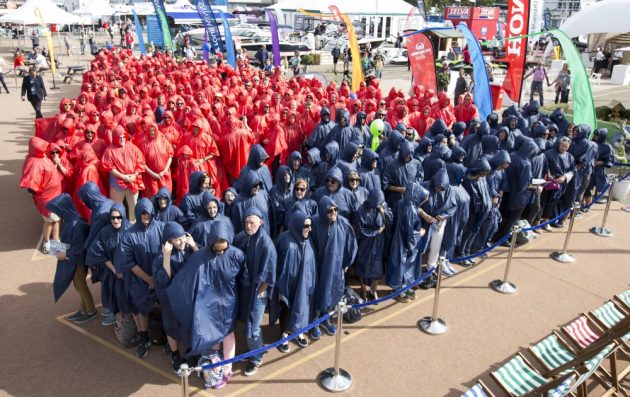 people wearing red and blue making a boat shape