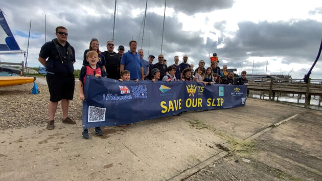 Southwold Sailing Club members with a Save Our Slip banner. Credit: Southwold Sailing Club
