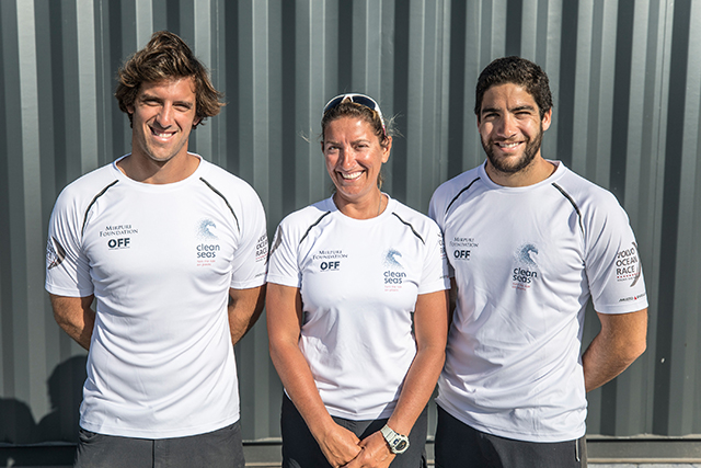 Sailors wearing white T-shire pose for a picture